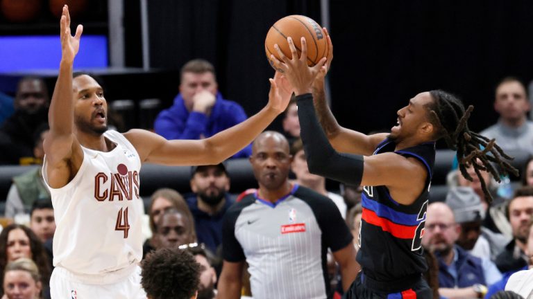 Detroit Pistons guard Daniss Jenkins, right, goes up for a shot against Cleveland Cavaliers centre Evan Mobley (4) during the second half of an NBA basketball game Friday, Feb. 27, 2026, in Detroit. (Duane Burleson/AP)