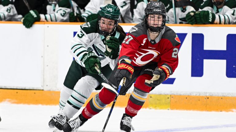 Boston Fleet's Liz Schepers (13) chases down Ottawa Charge's Brooke McQuigge (27) for control of the puck during second period PWHL hockey action in Ottawa, on Saturday, Feb. 28, 2026. (Spencer Colby/CP)