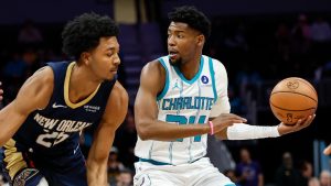 Charlotte Hornets forward Brandon Miller, right, looks to pass the ball against New Orleans Pelicans forward Trey Murphy III, left, during the first half of an NBA basketball game in Charlotte, N.C., Monday, Feb. 2, 2026. (Nell Redmond/AP)