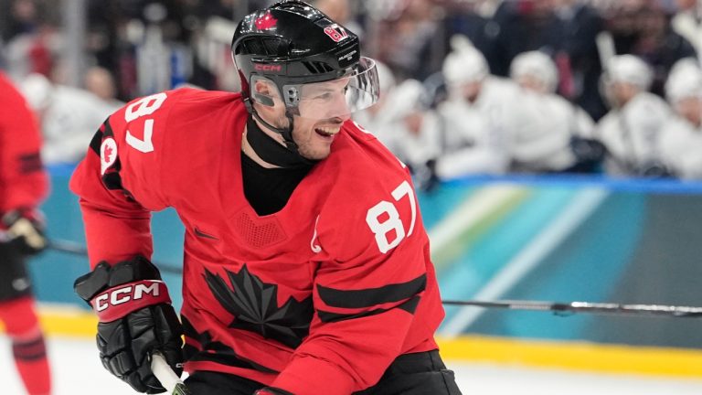 Canada's Sidney Crosby (87) reacts after scoring during a preliminary round game of men's ice hockey between Canada and France at the 2026 Winter Olympics, in Milan, Italy, Sunday, Feb. 15, 2026. (Hassan Ammar/AP)