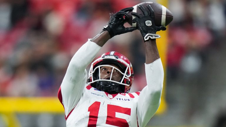 Calgary Stampeders' Dominique Rhymes (15) makes a reception during the second half of the CFL western semifinal football game against the B.C. Lions, in Vancouver, on Saturday, November 1, 2025. (Darryl Dyck/CP)