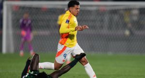 Nigeria's Daniel Bameyi falls while challenging Colombia's Emilio Aristizabal during a FIFA U-20 World Cup Group F soccer match at Fiscal Stadium in Talca, Chile, Sunday, Oct. 5, 2025. (Matias Delacroix/AP)