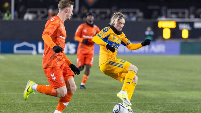 Tigres UANL's Marcelo Flores (20) tries to move the ball past Forge FC's Benjamin Paton (6) during round one of the 2026 CONCACAF Champions Cup in Hamilton, Tuesday, Feb. 3, 2026. (Nick Iwanyshyn/CP)