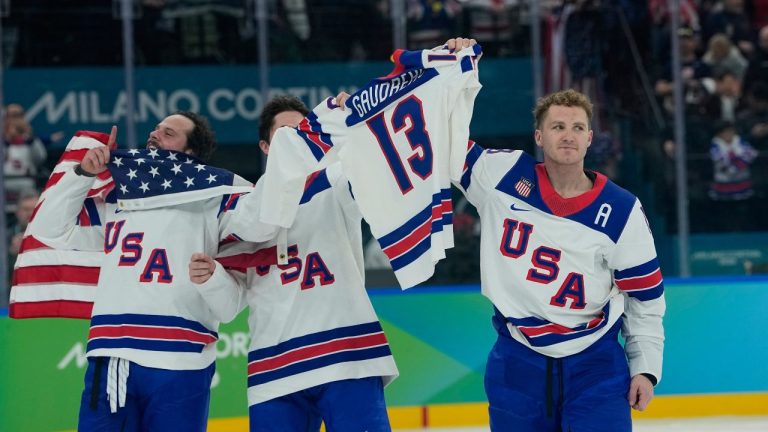 United States' Matthew Tkachuk (19), right, celebrates after the United States defeated Canada in a men's ice hockey gold medal game between Canada and the United States at the 2026 Winter Olympics, in Milan, Italy, Sunday, Feb. 22, 2026. (Petr David Josek/AP)
