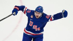 United States' Quinn Hughes celebrates after scoring the winning goal against Sweden during the overtime period of a men's ice hockey quarterfinal game at the 2026 Winter Olympics, in Milan, Italy, Wednesday, Feb. 18, 2026. (Hassan Ammar/AP)