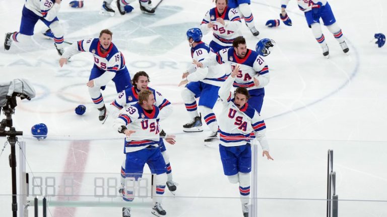 United States' Jack Hughes (86) celebrates his goal against Canada in overtime during the men's gold medal hockey game at the 2026 Winter Olympics, in Milan, on Sunday, Feb. 22, 2026. (Darryl Dyck/CP)