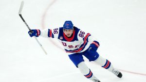 United States' Jack Hughes celebrates after scoring the winning goal against Canada during the overtime period of the men's ice hockey gold medal game at the 2026 Winter Olympics in Milan, Italy, Sunday, Feb. 22, 2026. (Carolyn Kaster/AP)