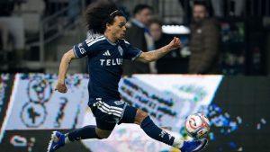 Vancouver Whitecaps' Aziel Jackson jumps to kick the ball against Real Salt Lake during the second half of an MLS match in Vancouver, on Saturday, Feb. 21, 2026. (THE CANADIAN PRESS/Ethan Cairns)