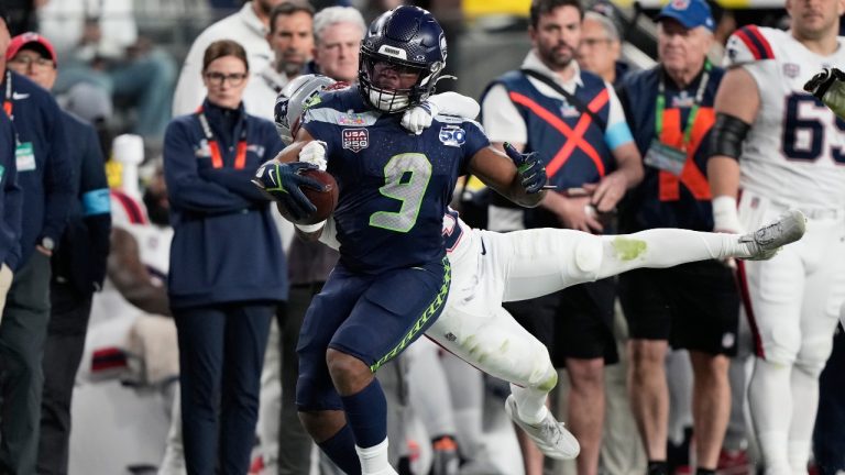 Seattle Seahawks running back Kenneth Walker III runs against New England Patriots cornerback Marcus Jones during the second half of the NFL Super Bowl 60 game, Sunday, Feb. 8, 2026, in Santa Clara, Calif. (AP/Doug Benc)