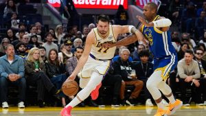 Los Angeles Lakers guard Luka Doncic moves the ball while defended by Golden State Warriors centre Al Horford during the first half of an NBA game, Saturday, Feb. 28, 2026, in San Francisco. (AP/Godofredo A. Vásquez)