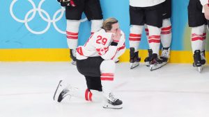 Canada's Marie-Philip Poulin cites after losing to the USA during overtime of the women's gold medal game at the 2026 Winter Olympics, in Milan, Thursday, Feb. 19, 2026. (THE CANADIAN PRESS/Nathan Denette)
