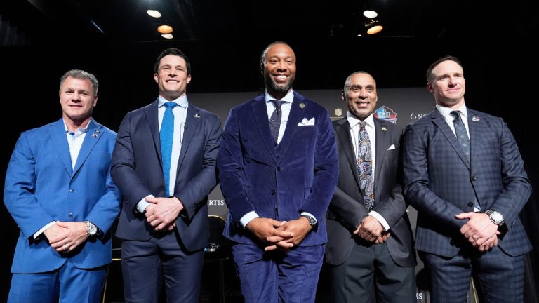 Adam Vinatieri, from left, stands with Luke Kuechly, Larry Fitzgerald, Roger Craig and Drew Brees after being announced for the Pro Football Hall of Fame class of 2026 during football's NFL Honors award show in San Francisco, Thursday, Feb. 5, 2026. (Brynn Anderson/AP)