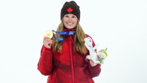 Canada' Megan Oldham celebrates her gold medal win in the women's freeski big air final at the Milano Cortina 2026 Winter Olympic Games in Livigno, Italy on Monday, Feb. 16, 2026. (Sean Kilpatrick/CP)
