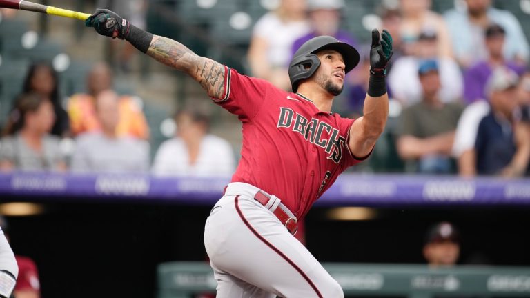 Arizona Diamondbacks' David Peralta flies out against Colorado Rockies starting pitcher Chad Kuhl during the first inning of a baseball game, Sunday, July 3, 2022, in Denver. (AP/David Zalubowski)