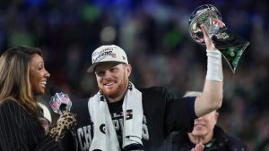 Seattle Seahawks quarterback Sam Darnold lifts the Lombardi Trophy after a win over the New England Patriots in the NFL Super Bowl 60 football game Sunday, Feb. 8, 2026, in Santa Clara, Calif. (Matt Slocum/AP)