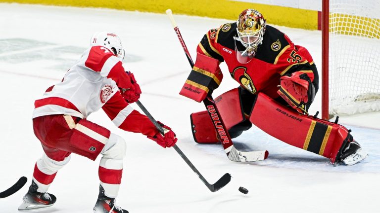 Detroit Red Wings' Dylan Larkin (71) scores on Ottawa Senators' goaltender Linus Ullmark (35) during overtime NHL hockey action in Ottawa, on Thursday, Feb. 26, 2026. THE CANADIAN PRESS/Spencer Colby