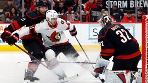 Ottawa Senators' Dylan Cozens has his shot blocked by Carolina Hurricanes goaltender Brandon Bussi (32) with Jordan Staal nearby during the first period of an NHL hockey game in Raleigh, N.C., Tuesday, Feb. 3, 2026. (Karl DeBlaker/AP)