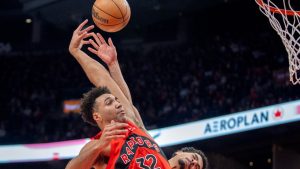 Toronto Raptors forward Trayce Jackson-Davis is fouled by Indiana Pacers guard Ben Sheppard (back) as he soars in for a dunk during second half NBA action in Toronto, Sunday, Feb. 8, 2026. (THE CANADIAN PRESS/Frank Gunn)