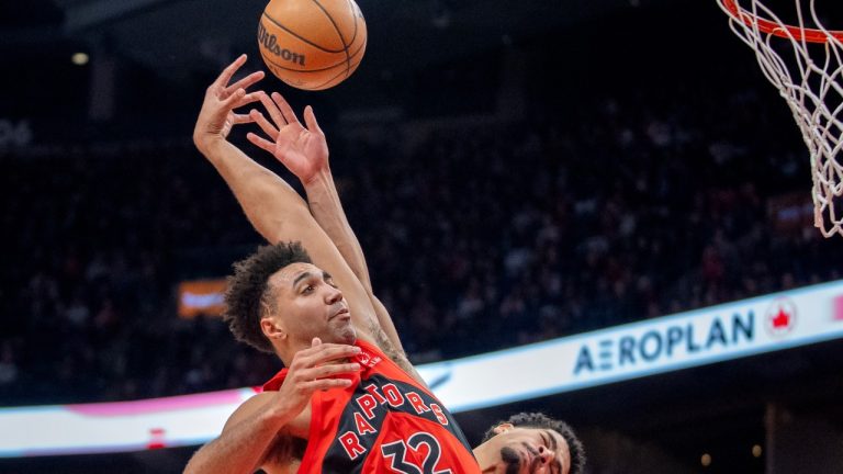 Toronto Raptors forward Trayce Jackson-Davis is fouled by Indiana Pacers guard Ben Sheppard (back) as he soars in for a dunk during second half NBA action in Toronto, Sunday, Feb. 8, 2026. (THE CANADIAN PRESS/Frank Gunn)