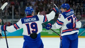 United States' Tage Thompson (72) celebrates with teammates after scoring his side's second goal during a men's ice hockey semifinal game between United States and Slovakia at the 2026 Winter Olympics, in Milan, Italy, Friday, Feb. 20, 2026. (Petr David Josek/AP)