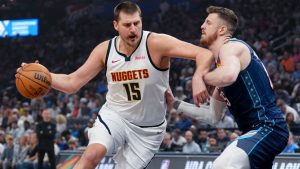 Denver Nuggets center Nikola Jokic, left, drives past Oklahoma City Thunder center Isaiah Hartenstein, right, during the first half of an NBA basketball game, Friday, Feb. 27, 2026, in Oklahoma City. (AP Photo/Kyle Phillips)