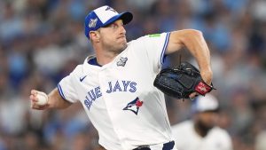 Toronto Blue Jays pitcher Max Scherzer (31) delivers a pitch against the Los Angeles Dodgers during first inning Game 7 World Series playoff MLB baseball action in Toronto on Saturday, Nov. 1, 2025. (Nathan Denette/CP)