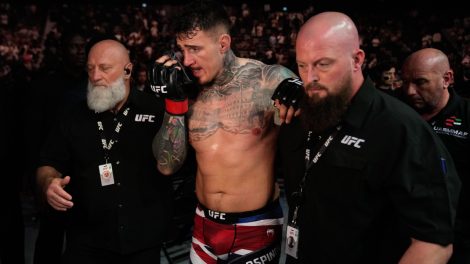 England's-Tom-Aspinall-leaves-the-Octagon-at-UFC-321-after-his-fight-was-called-off-when-his-eyes-were-poked-by-Ciryl-Gane-of-France-during-their-heavyweight-title-bout-in-Abu-Dhabi
