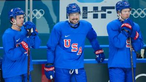 Team USA forward Auston Matthews, centre, smiles with his teammates at practice during the 2026 Milan Cortina Winter Olympics in Milan, Italy on Sunday, February 8, 2026. (Nathan Denette/AP)
