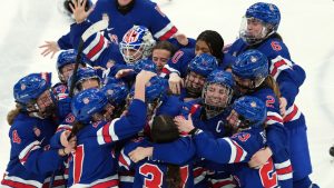 USA celebrates the win over Canada during overtime of the women's gold medal hockey game at the 2026 Winter Olympics, in Milan, Thursday, Feb. 19, 2026. (Nathan Denette/CP)