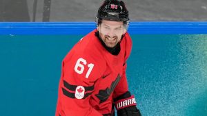 Canada's Mark Stone (61) celebrates after scoring a goal during a preliminary round game of men's ice hockey between Canada and France at the 2026 Winter Olympics, in Milan, Italy, Sunday, Feb. 15, 2026. (AP Photo/Hassan Ammar)