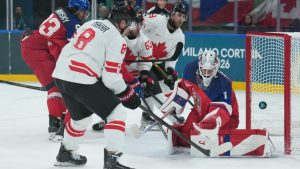 Lukas Dostal of Team Czechia makes a save on Cale Makar of Team Canada during third period action at the 2026 Milan Cortina Winter Olympics in Milan, Italy, on Thursday, Feb. 12, 2026. (CP/Nathan Denette)