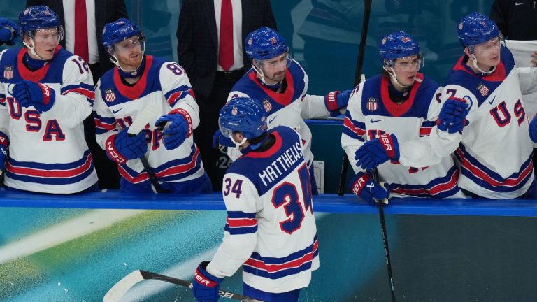 United States' Auston Matthews celebrates with teammates after scoring his sides fifth goal during a preliminary round match of men's ice hockey between Latvia and the United States at the 2026 Winter Olympics, in Milan, Italy, Thursday, Feb. 12, 2026. (Carolyn Kaster/AP)
