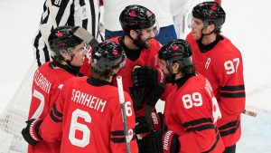 Canada's Tom Wilson (43) celebrates after scoring a goal during a preliminary round game between Canada and France at the 2026 Winter Olympics, in Milan, Italy, Sunday, Feb. 15, 2026. (AP Photo/Hassan Ammar)