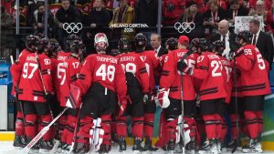 Canada head coach Jon Cooper talks to the team after the win over Switzerland after a preliminary-round game at the 2026 Winter Olympics, in Milan, on Friday, Feb. 13, 2026. (CP/Darryl Dyck)