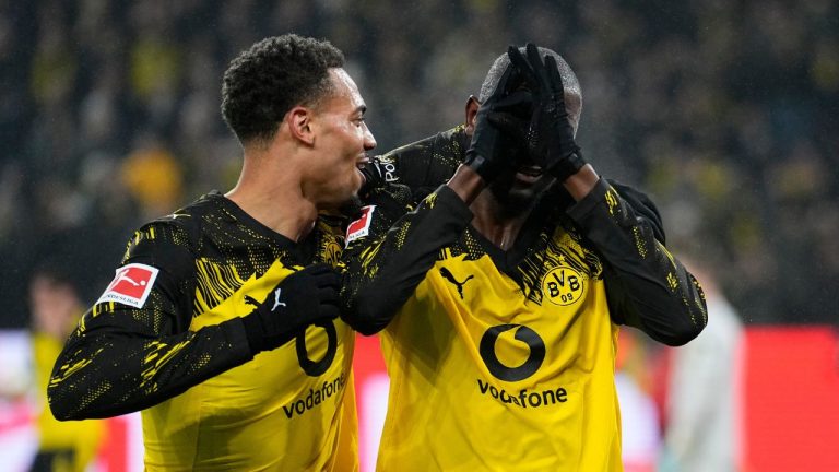 Dortmund's Serhou Guirassy, right, celebrates with Dortmund's Felix Nmecha after scoring his side's third goal during the German Bundesliga soccer match between Borussia Dortmund and FSV Mainz 05 in Dortmund, Germany, Friday, Feb. 13, 2026. (AP Photo/Martin Meissner)