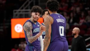 Charlotte Hornets' LaMelo Ball (1) celebrates with Miles Bridges (0) after they pulled ahead of Houston during the first half of an NBA basketball game, Thursday, Feb. 5, 2026, in Houston. (Karen Warren/AP)