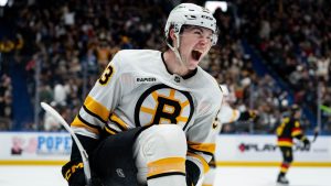 Boston Bruins' Fraser Minten celebrates his game-winning goal against the Vancouver Canucks during overtime NHL action in Vancouver, on Saturday, January 3, 2026. (Ethan Cairns/CP)
