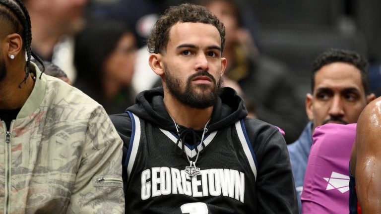 Washington Wizards guard Trae Young, center, looks on from the bench during the first half of an NBA basketball game against the Los Angeles Clippers, Jan. 19, 2026, in Washington. (AP Photo/Nick Wass, File)