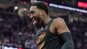 Cleveland Cavaliers guard Donovan Mitchell (45) celebrates in the first half of an NBA basketball game against the Brooklyn Nets in Cleveland, Thursday, Feb. 19, 2026. (AP Photo/Sue Ogrocki)