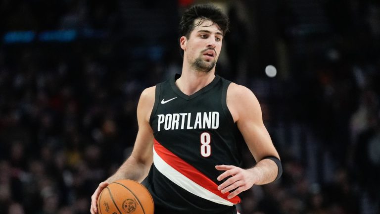 Portland Trail Blazers forward Deni Avdija dribbles during the first half of an NBA basketball game against the Denver Nuggets, Friday, Feb. 20, 2026, in Portland, Ore. (AP Photo/Jenny Kane)