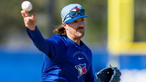 Toronto Blue Jays pitcher Kevin Gausman makes a throw to first base during a drill at Spring Training in Dunedin, Fla., on Monday, Feb. 16, 2026. THE CANADIAN PRESS/Frank Gunn