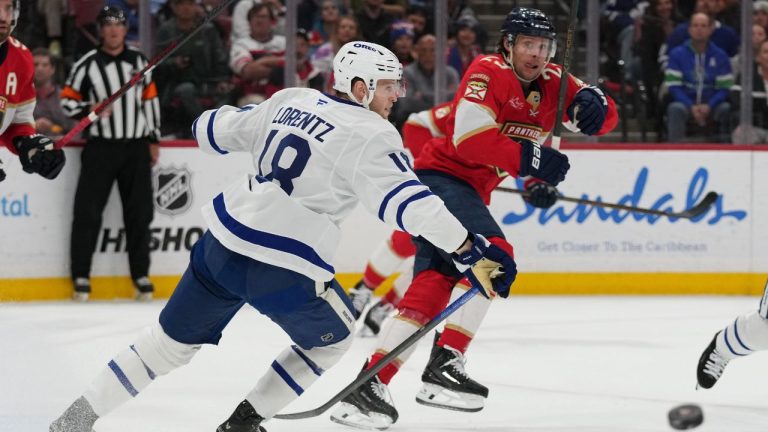 Toronto Maple Leafs center Steven Lorentz (18) and Florida Panthers center Carter Verhaeghe (23) go for the puck during the first period of an NHL hockey game, Thursday, Feb. 26, 2026, in Sunrise, Fla. (AP Photo/Lynne Sladky)