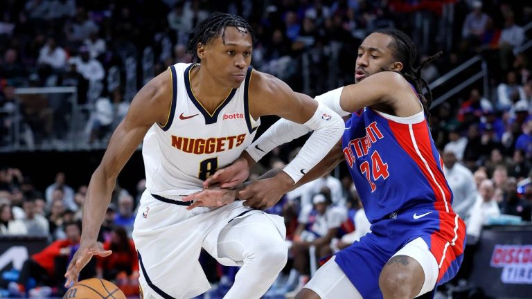 Denver Nuggets guard Peyton Watson (8) tries driving to the basket against Detroit Pistons guard Daniss Jenkins (24) during the second half of an NBA basketball game Tuesday, Feb. 3, 2026, in Detroit. (Duane Burleson/AP)