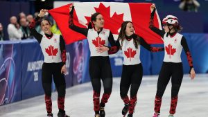 Team Canada celebrate winning the bronze during the short track speed skating women's team 3000m relay final at the 2026 Winter Olympics, in Milan, Italy, Wednesday, Feb. 18, 2026.(Stephanie Scarbrough/AP)
