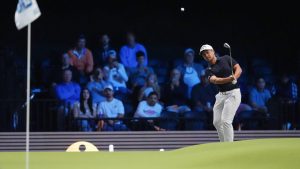 Xander Schauffele of New York Golf Club watches his shot on the green on the 12th hole during the inaugural match of the TMRW Golf League, against The Bay Golf Club, Tuesday, Jan. 7, 2025, in Palm Beach Gardens, Fla. (Rebecca Blackwell/AP)