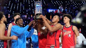 USA Stars lift the championship trophy after a win over USA Stripes in the NBA All-Star basketball game Sunday, Feb. 15, 2026, in Inglewood, Calif. (Mark J. Terrill/AP)
