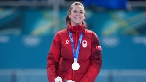 Canada's Ivanie Blondin (12) collects her silver medal for the second-place finish in the women's mass start speedskating finals at the 2026 Winter Olympics, in Milan, Saturday, Feb. 21, 2026. (Darryl Dyck/THE CANADIAN PRESS)
