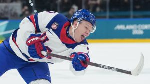 United States' Brady Tkachuk shoots to score his sides first goal during a preliminary round match of men's ice hockey between Latvia and the United States at the 2026 Winter Olympics, in Milan, Italy, Thursday, Feb. 12, 2026. (Carolyn Kaster/AP)