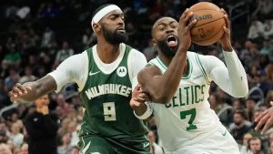 Boston Celtics' Jaylen Brown (7) drives to the basket against Milwaukee Bucks' Bobby Portis (9) during the second half of an NBA basketball game Thursday, Dec. 11, 2025, in Milwaukee. (Aaron Gash/AP)