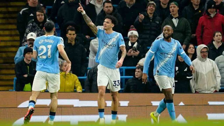 Manchester City's Nico O'Reilly, center, celebrates with teammates after scoring his side's second goal during the English Premier League soccer match between Manchester City and Fulham in Manchester, England, Wednesday, Feb. 11, 2026. (Dave Thompson/AP)